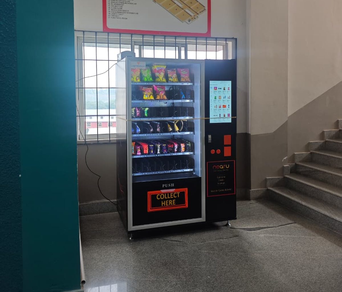 A NearU vending machine installed and trading on a Kerala college campus